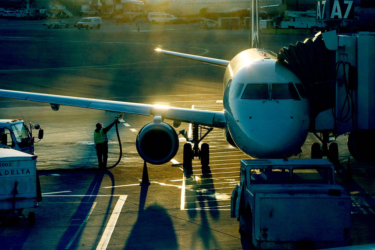 A plane is refueled at Logan International Airport in Boston. Transportation, including security screening, would be virtually unaffected by a government shutdown. (AP Photo/Bill Sikes)