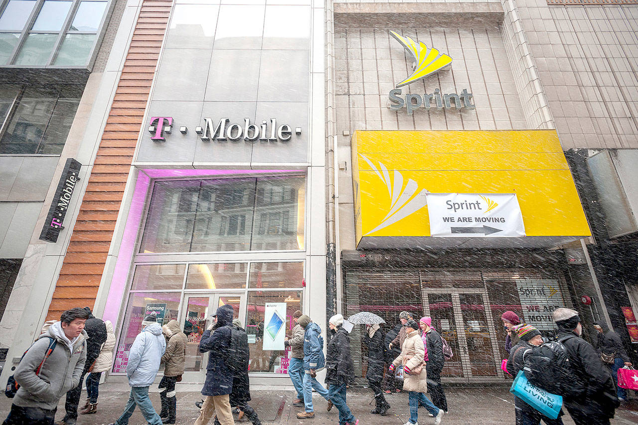 T-Mobile and a former Sprint cellular phone store adjoin each other in Herald Square in New York. (Richard B. Levine / Sipa USA)