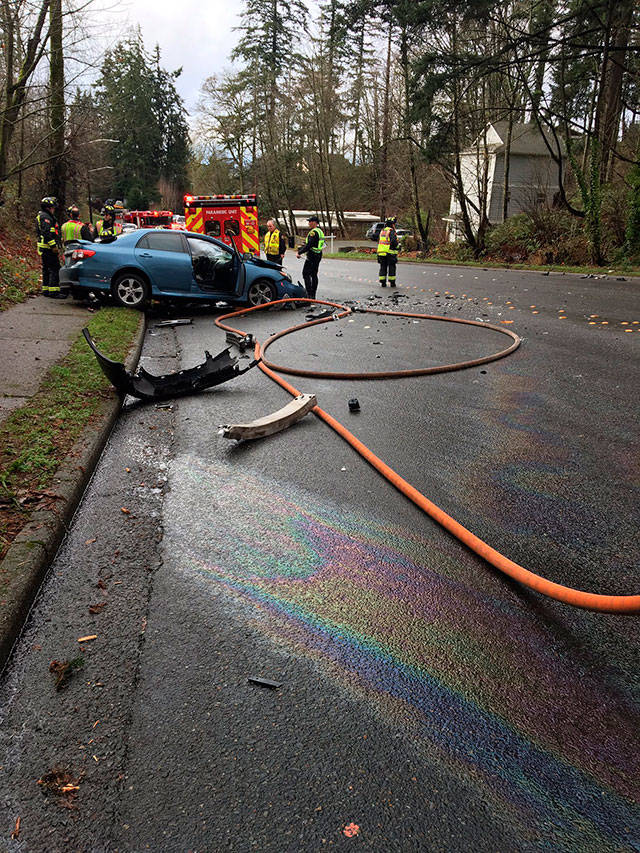 Oil is visible on the road in the 4000 block of 164th Street Southwest in Lynnwood. The slick roadway may have contributed to a head-on crash there Dec. 23. (South Snohomish County Fire & Rescue)