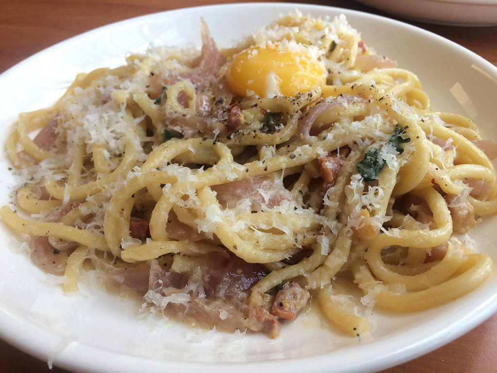 Caper and Olives’ bucatini pasta, handmade by chef and owner Jimmy Liang, features pancetta, red onion and egg yolk. (Evan Thompson / Herald file)
