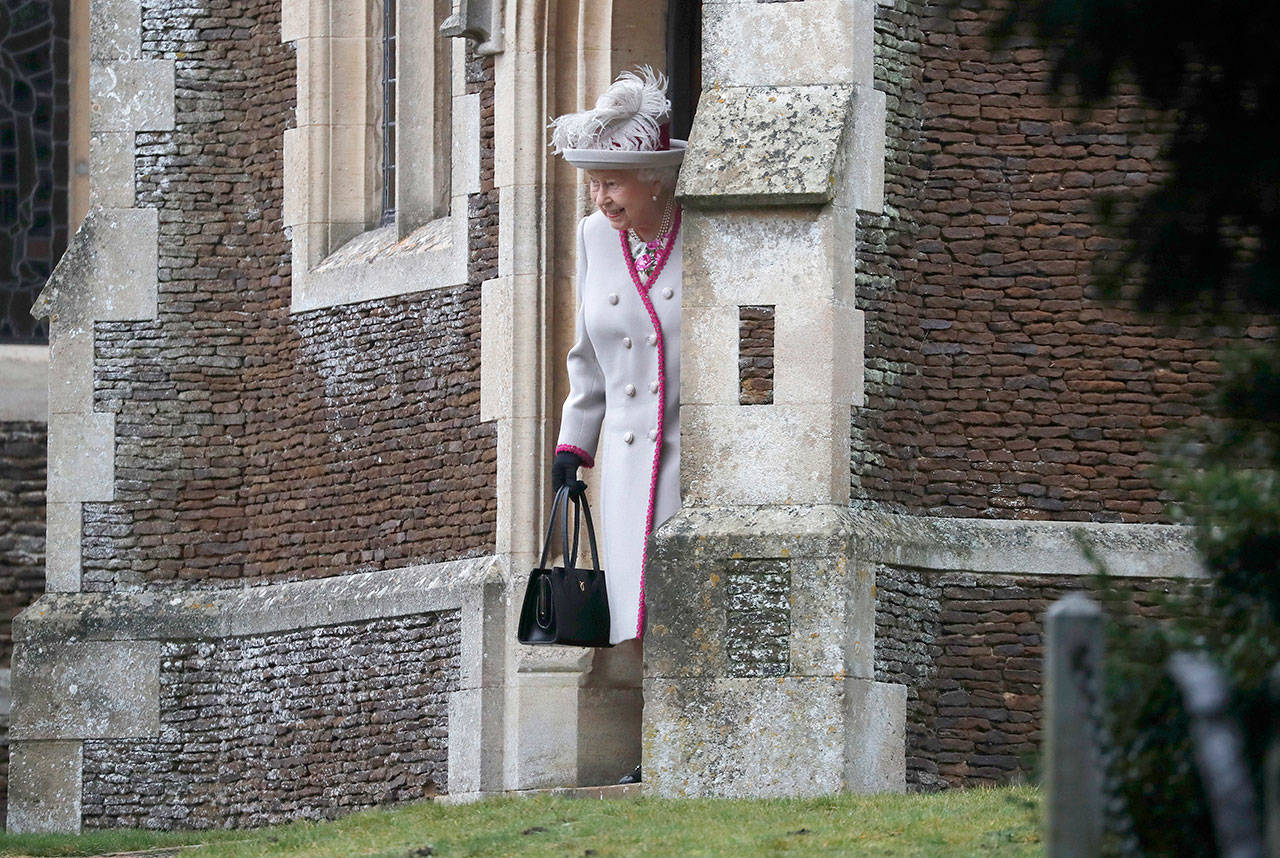 Britain’s Queen Elizabeth II leaves after attending the Christmas Day service at St Mary Magdalene Church in Sandringham in Norfolk, England, on Tuesday. (Frank Augstein / Associated Press)