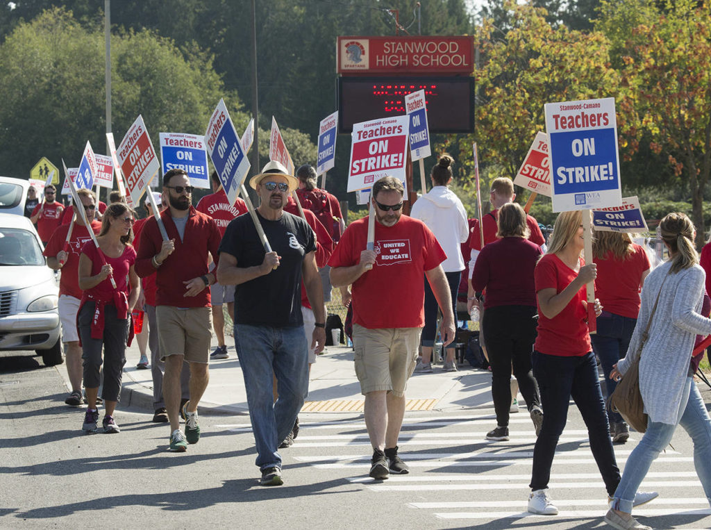 Striking Stanwood teachers, seen here Sept. 4, claimed the state Supreme Court’s decision on school funding made it clear that “salary adjustments were long overdue.” (Andy Bronson / Herald file)
