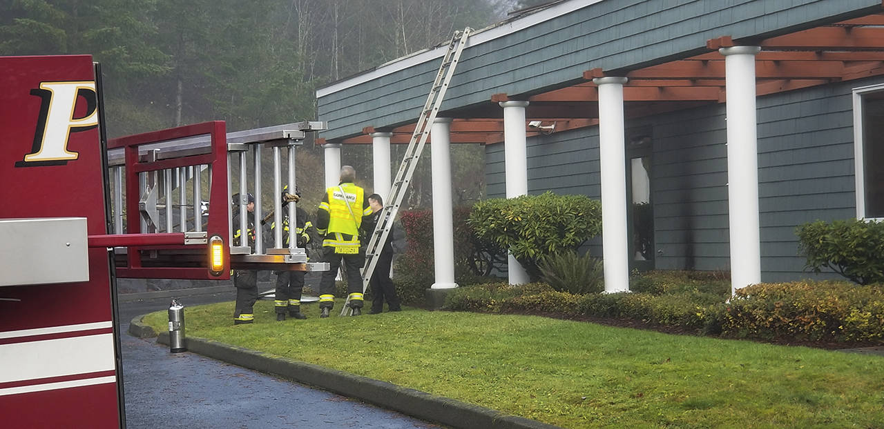 Fire crews found a small, smoldering fire on a rooftop overhang at Kitsap Bank in Poulsbo. (Kitsap Daily News)