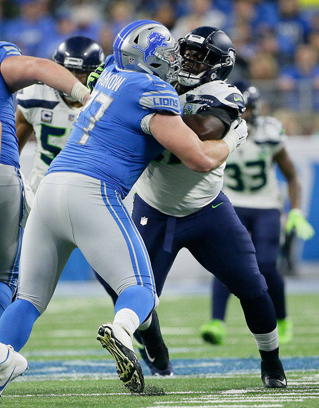 Seahawks defensive tackle Poona Ford (right) battles with Lions offensive guard Frank Ragnow (77) during the second half of a game on Oct. 28, 2018, in Detroit. (AP Photo/Duane Burleson)