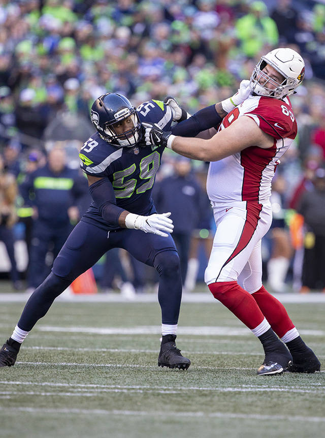 Seattle’s Jake Martin defends against Arizona’s Rees Odhiambo during the Seahawks’ 27-24 win over Arizona on Sunday at CenturyLink Field in Seattle. (TJ Mullinax / For the Herald)
