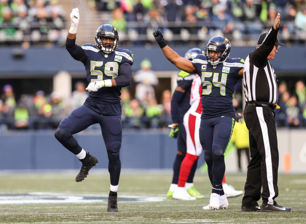 Seattle’s Jake Martin celebrates stopping the Cardinals on a fourth down play during the Seahawks’ 27-24 win over Arizona on Sunday at CenturyLink Field in Seattle. (Andy Bronson / The Herald)
