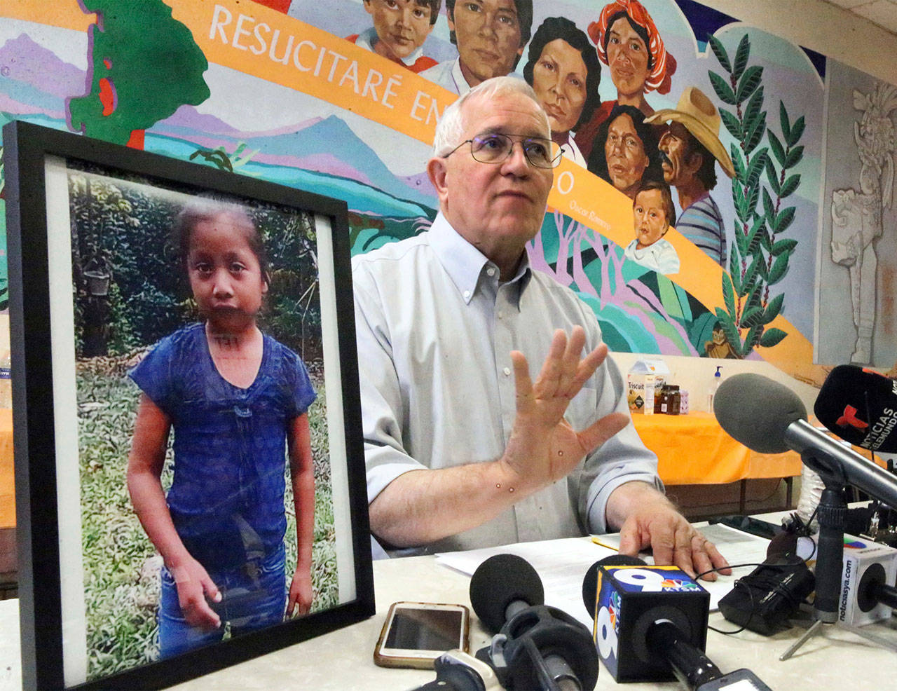 Annunciation House director Ruben Garcia answers questions from the media Dec. 15, after reading a statement from the family of Jakelin Caal Maquin, pictured at left, during a press briefing at Casa Vides in downtown El Paso, Texas. Caal, died Dec. 8 in El Paso. She showed signs of sepsis shock, a potentially fatal condition brought on by infection, officials said. (Rudy Gutierrez/The El Paso Times via AP, File)