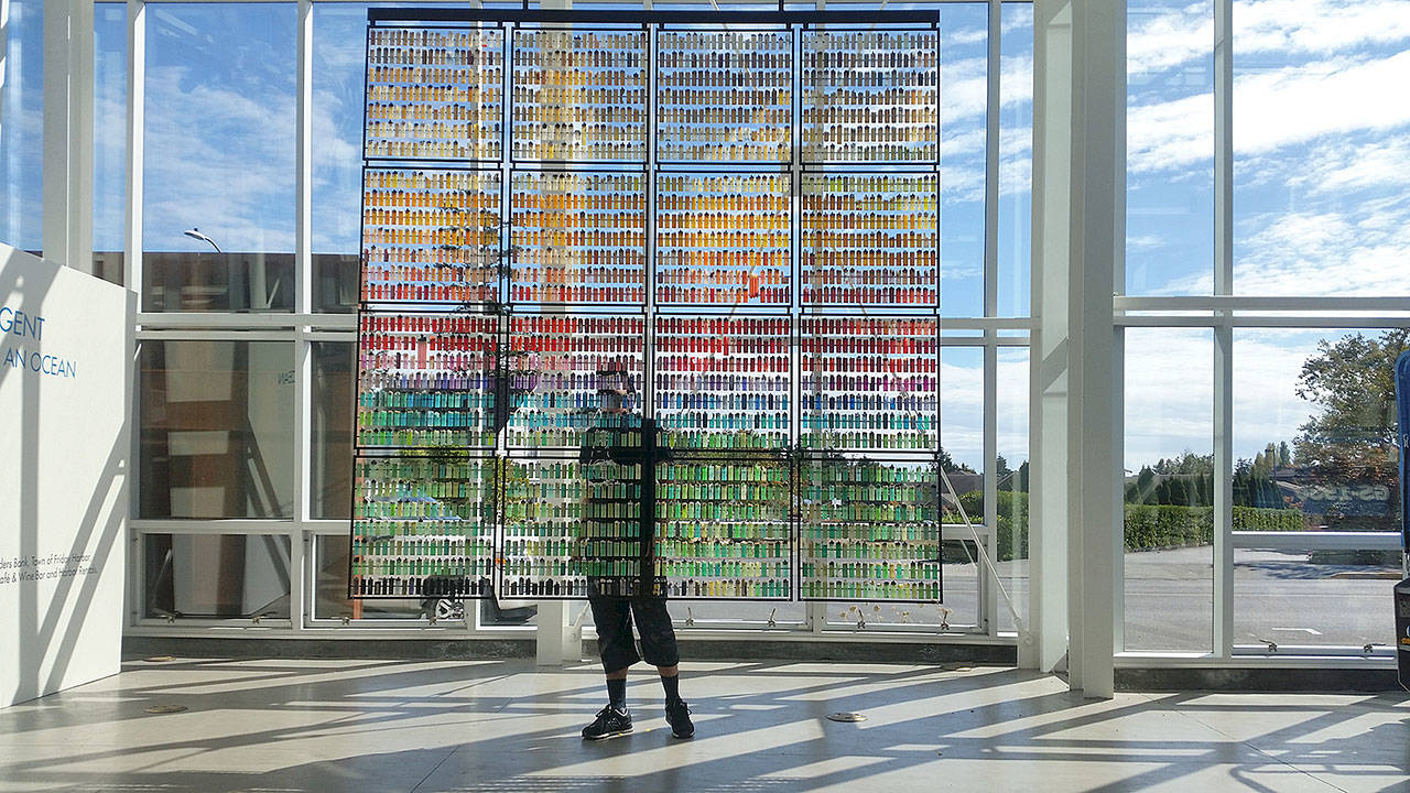 “All the little things,” on exhibit at the Schack Art Center in Everett, is made from marine debris and metal armature, namely “disposable” lighters.