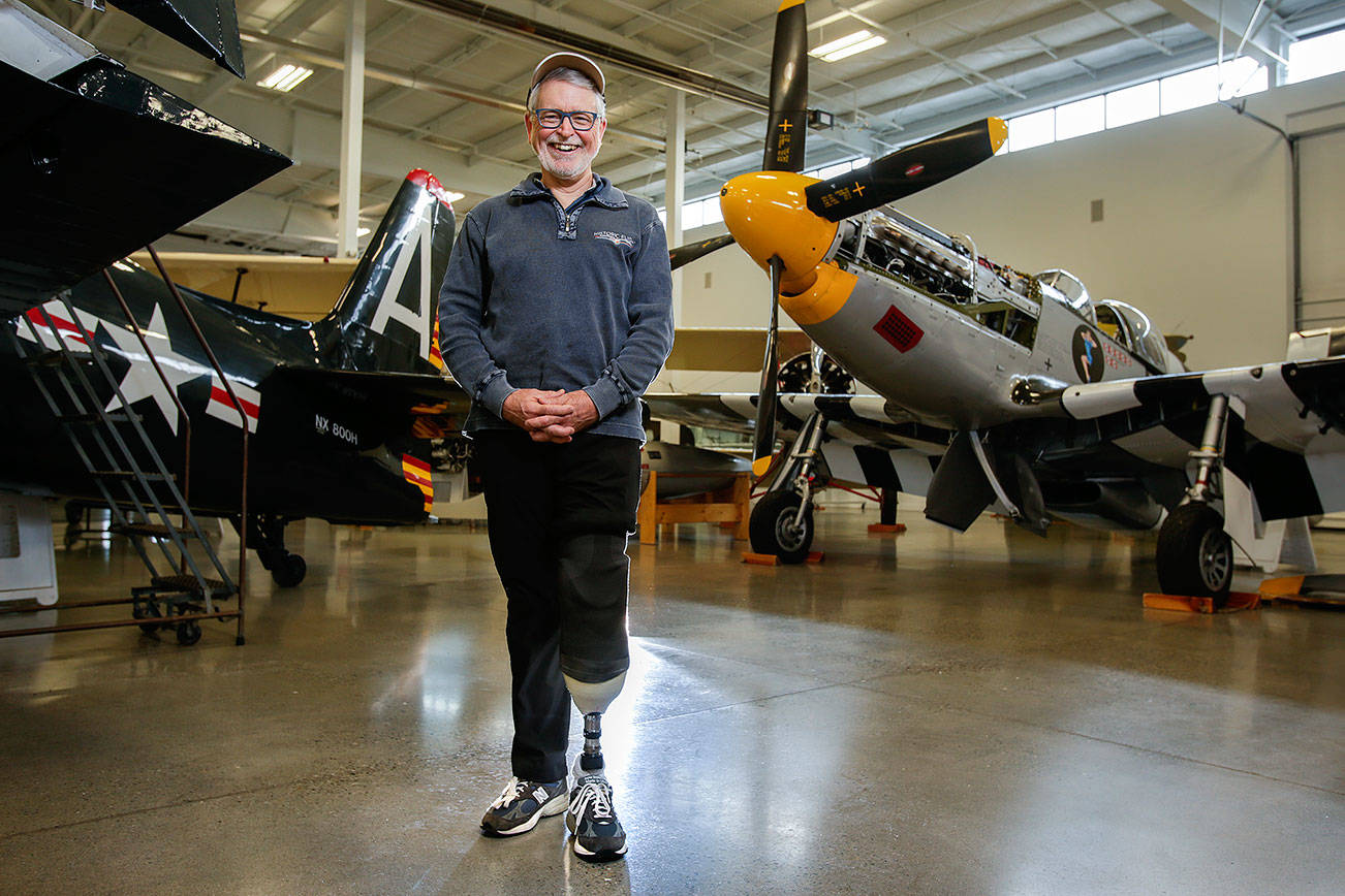 Wearing a prosthetic, Historic Flight Foundation president John Sessions talks about his airplane crash, that cost him his left leg, on Friday, Dec. 21, 2018 in Everett, Wa. Sessions lost his left foot during an August crash while piloting a 1930s vintage biplane during an airshow in British Columbia. (Andy Bronson / The Herald)