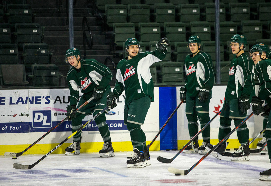 Zack Andrusiak talks to his teammates during Silvertips practice Wednesday in Everett. (Olivia Vanni / The Herald)
