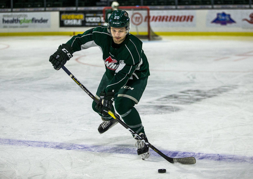 Zack Andrusiak skates with the puck during Silvertips practice Wednesday in Everett. (Olivia Vanni / The Herald)
