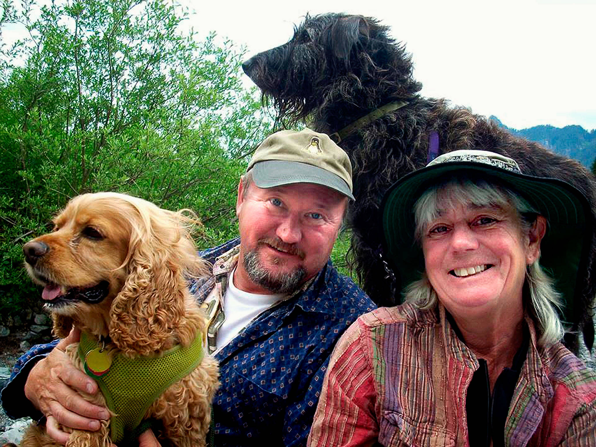 Andy Sudkamp, shown here with his wife, Mary Ann and their dogs, was an Everett High School biology teacher who died during a 2015 hiking trip at the Grand Canyon. The Evergreen Arboretum & Gardens Society seeks $10,000 in donations for a sculpture at Legion Park to commemorate his life. (Contributed Photo)