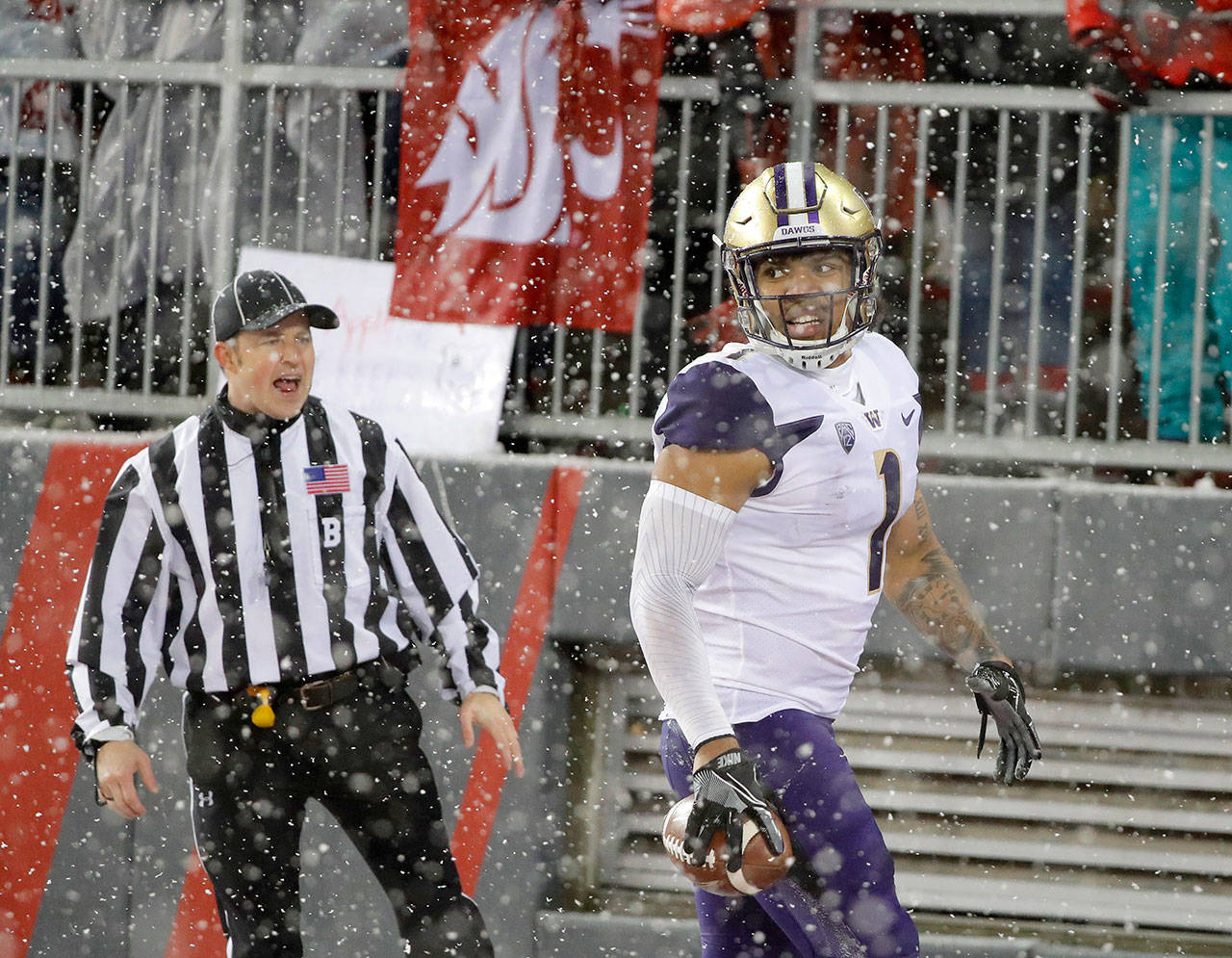 Washington’s Hunter Bryant celebrates after catching a touchdown pass in the Apple Cup on Nov. 23 in Pullman. (AP Photo/Ted S. Warren)