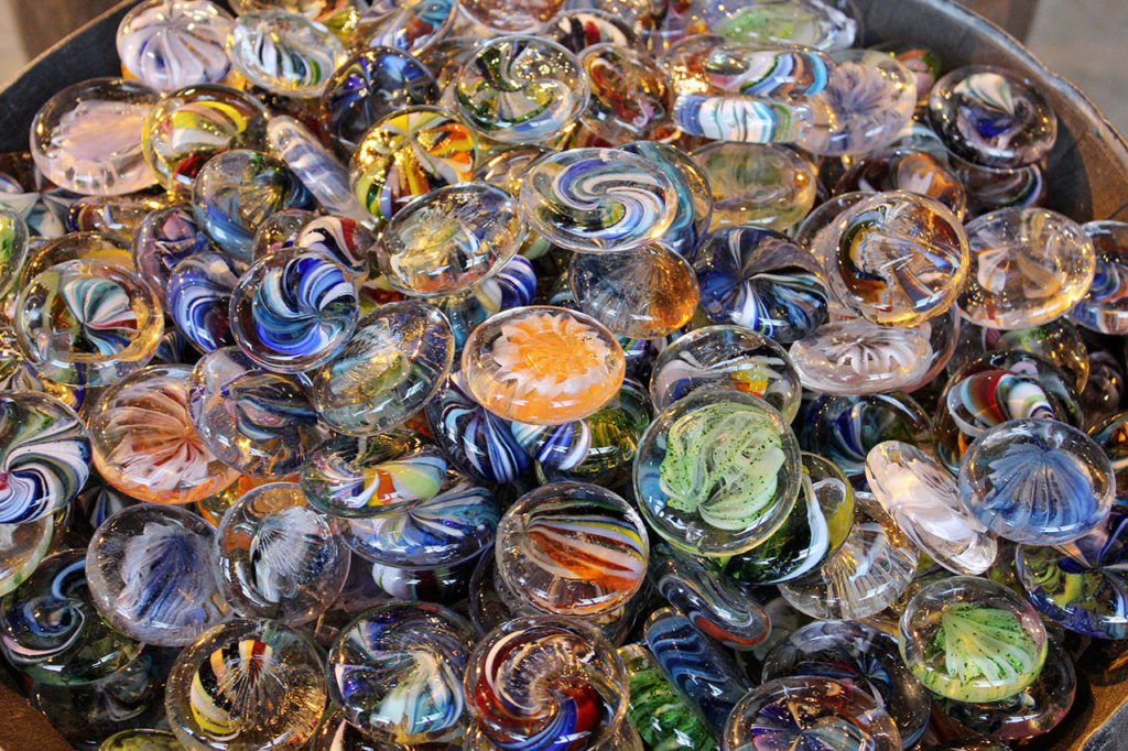 Callahan’s Firehouse also makes hundreds of small glass “wishing stones” that are given away during the Sea Float Scramble. (Patricia Guthrie / Whidbey News Group)
