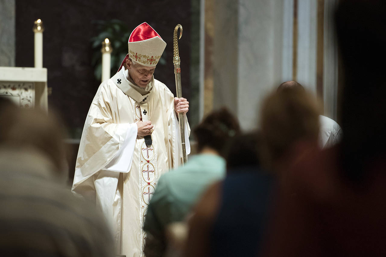 In this Aug. 15, 2018 photo, Cardinal Donald Wuerl, Archbishop of Washington, conducts Mass at St. Mathews Cathedral in Washington. (AP Photo/Kevin Wolf, File)
