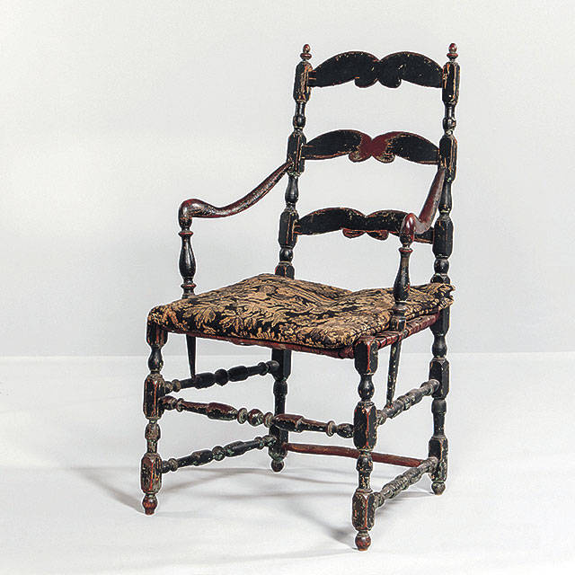 A Canadian slat-back chair is sometimes found in the United States. There were many more chair makers in the U.S. than in Canada, so the chairs are harder to find. This Canadian chair sold for $1,200, well over the estimated price. (Cowles Syndicate Inc.)