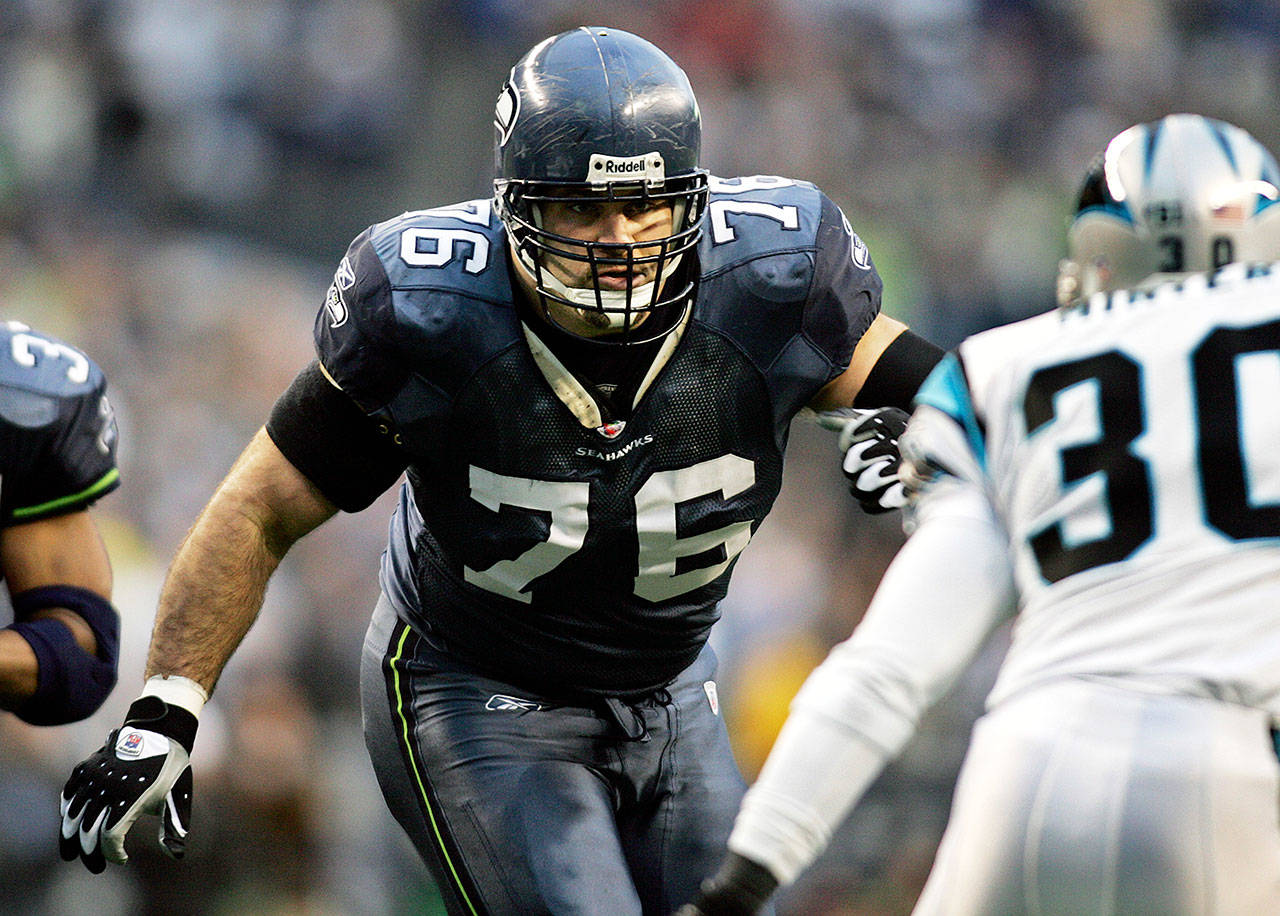 Seattle Seahawks offensive guard Steve Hutchinson blocks against the Carolina Panthers during the NFC Championship Game in Seattle on Jan. 22, 2006. (John Froschauer / Associated Press)