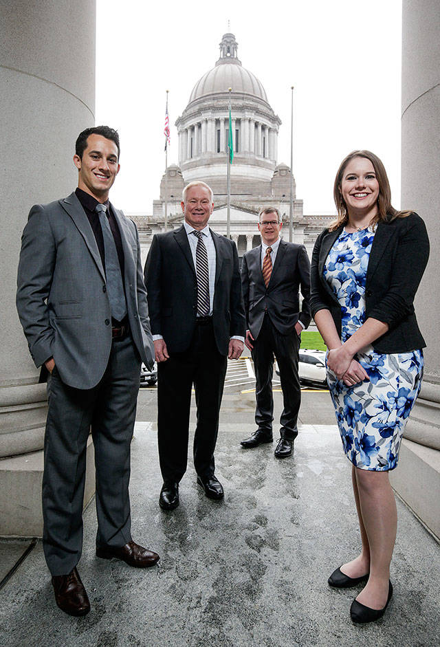 Snohomish County’s newest representatives gather outside the Capitol during a break in orientation activities ahead of Monday’s start of the 2019 session. Pictured are Democrat Jared Mead (from left), of Mill Creek, Republican Robert Sutherland, of Granite Falls, Democrat Dave Paul, of Oak Harbor, and Democrat Lauren Davis, of Shoreline. (Andy Bronson / The Herald)