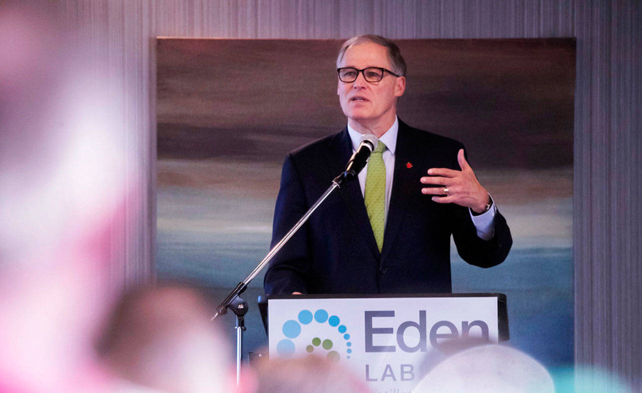 Gov. Jay Inslee speaks at the annual Washington Cannabis Summit on Friday in SeaTac. Seven years after the state legalized the adult use of marijuana, Inslee says he plans to pardon thousands of convictions for misdemeanor pot possession. (Erika Schultz / The Seattle Times)