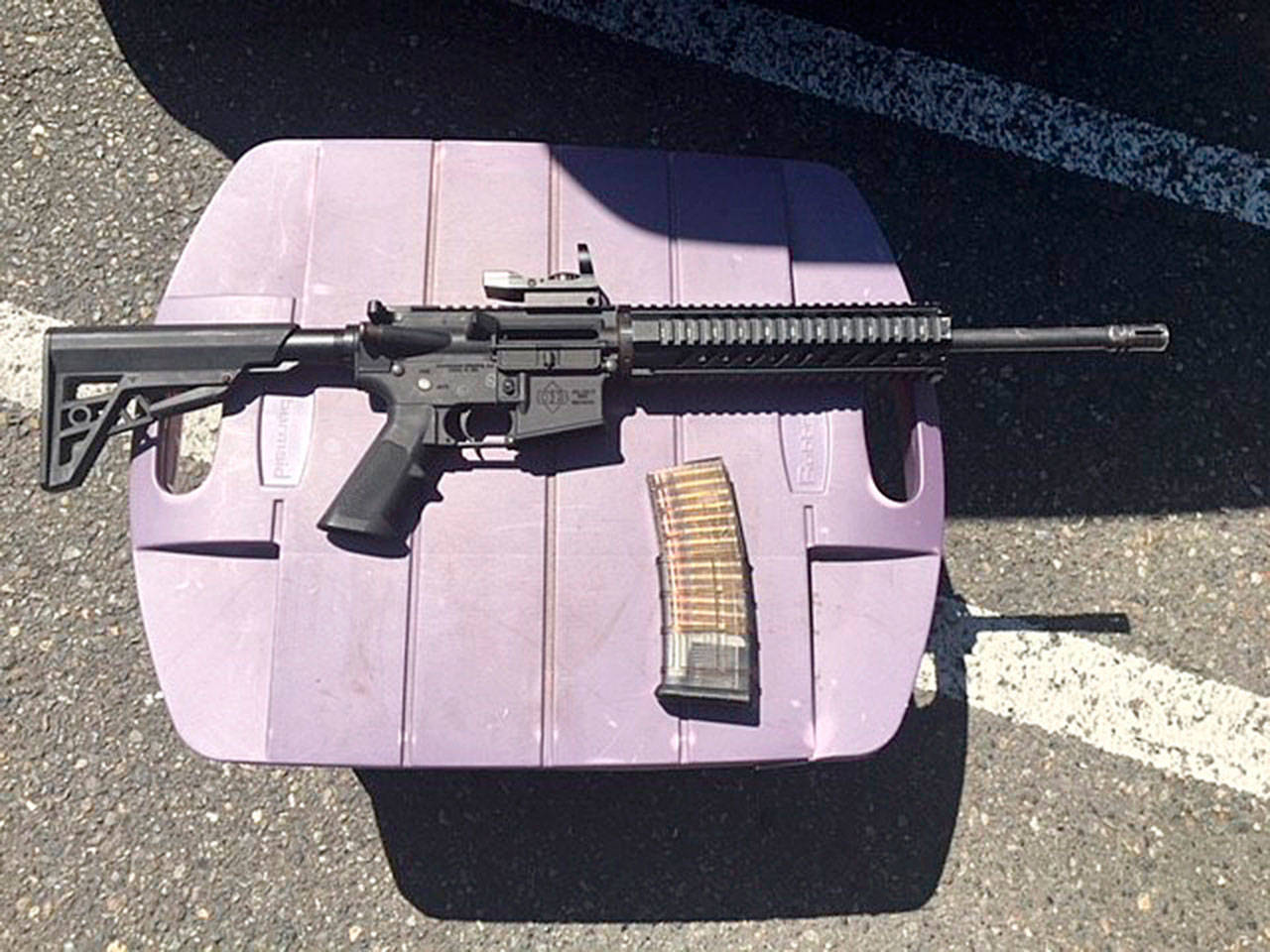 AR-15 rifle and a loaded magazine that were recovered from a suspect in a shooting incident at the Kent Station parking garage. Photo courtesy of King County Sheriff’s Office                                An AR-15 rifle and a loaded magazine were recovered from a suspect in a shooting incident at the Kent Station parking garage. (King County Sheriff’s Office)