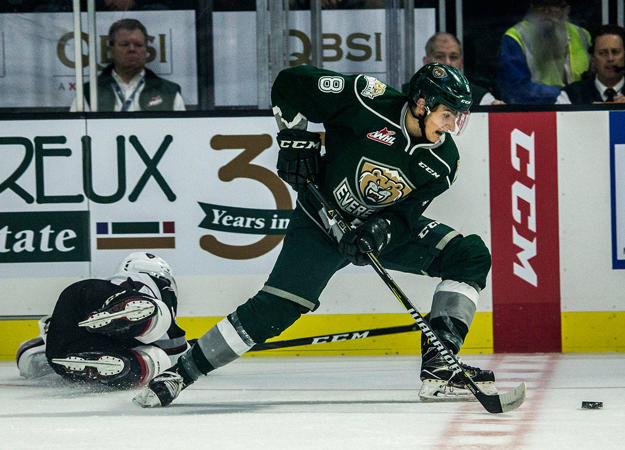 The Silvertips’ Ronan Seeley escapes a hit during a game against the Giants on Sept. 22, 2018, in Everett. (Olivia Vanni / The Herald)