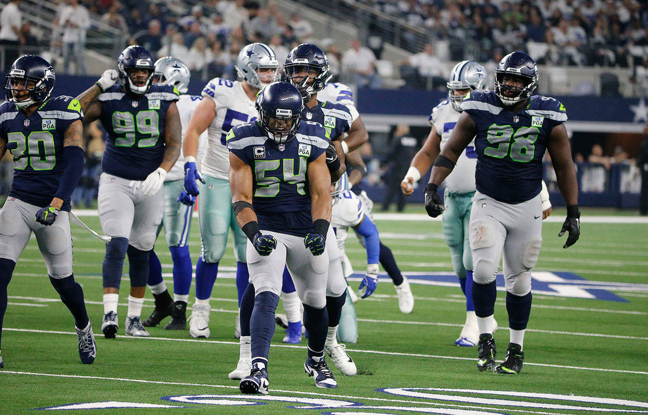 Seahawks linebacker Bobby Wagner (54) celebrates a fourth-down stop during a playoff game against the Cowboys on July 5, 2019, in Arlington, Texas. (AP Photo/Michael Ainsworth)