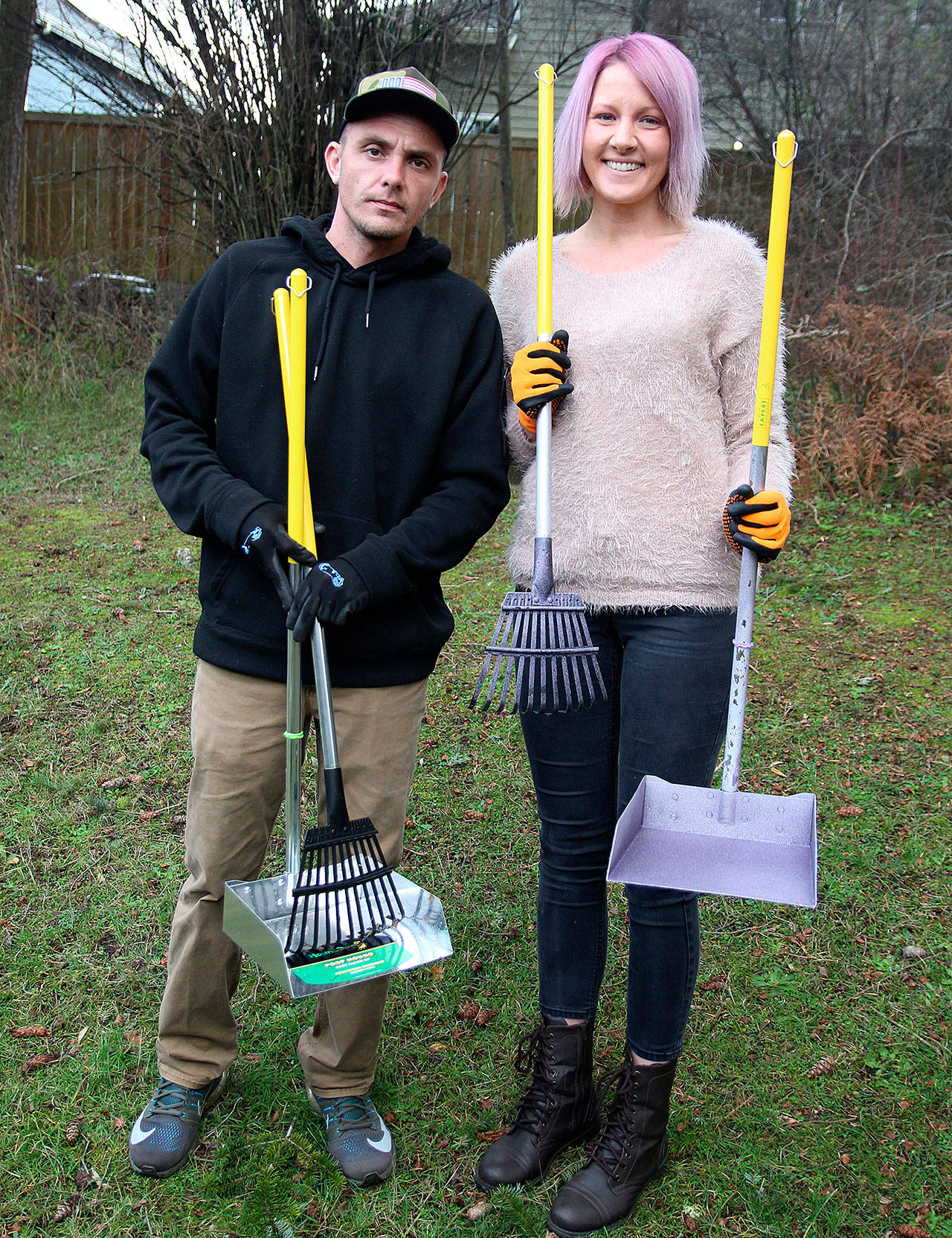 Pooper Trooper owners Conrad (left) and Shannon Useman display their Pooper Trooper supplies. (Laura Guido / Whidbey News Group)