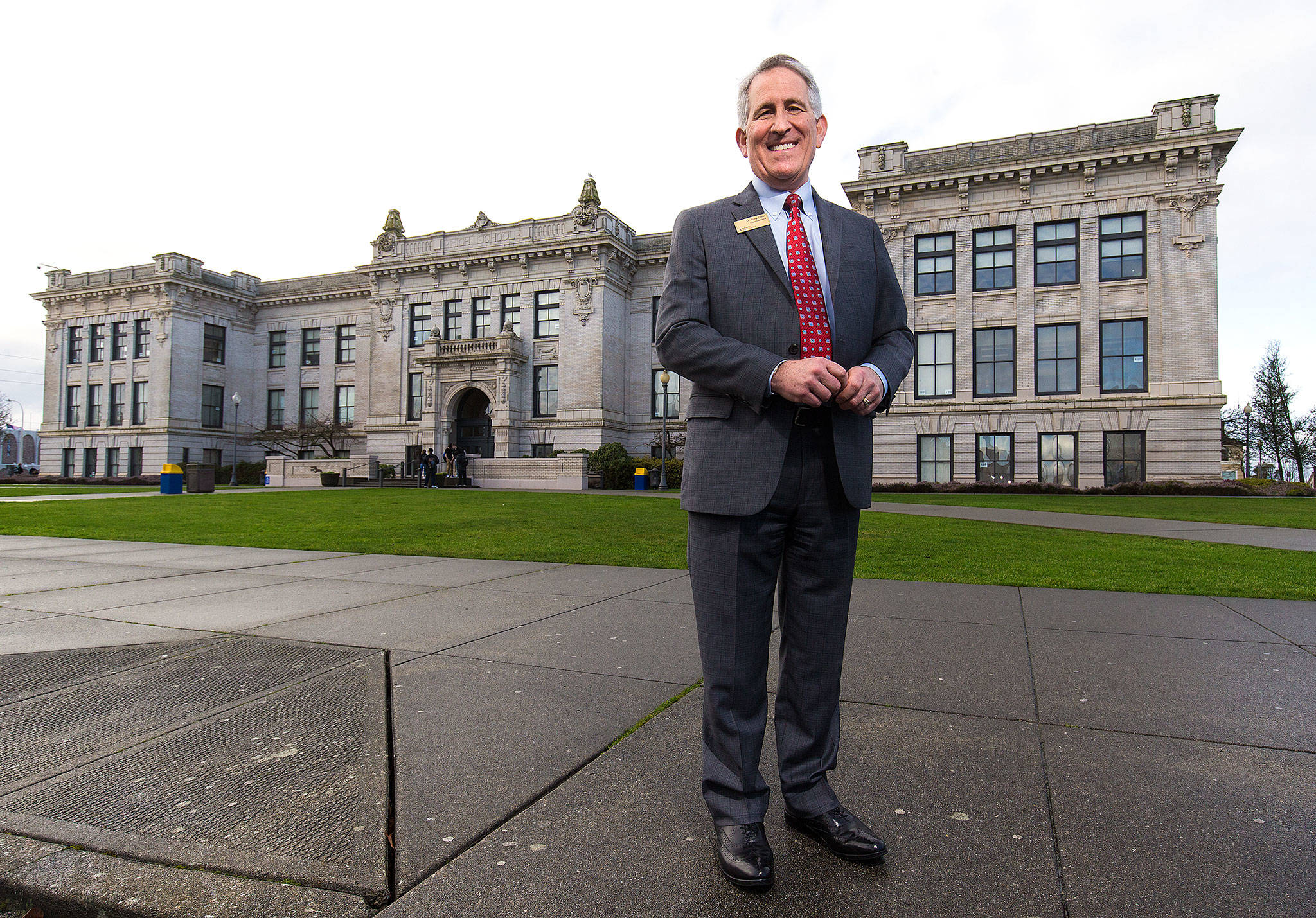 Everett School District Superintendent Gary Cohn poses in front of Everett High School on Thursday. Cohn is retiring after 39 years in education. (Andy Bronson / The Herald)