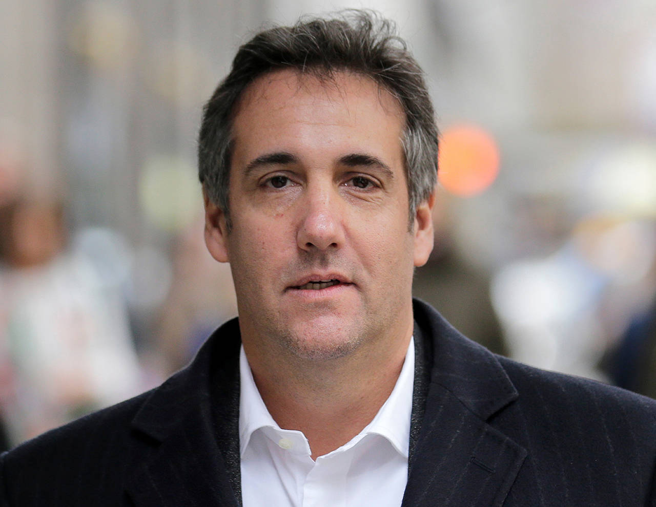 In this April 2018 photo, Michael Cohen, President Donald Trump’s former attorney, walks along a sidewalk in New York. Cohen will testify publicly before Congress in February. (AP Photo/Seth Wenig, File)