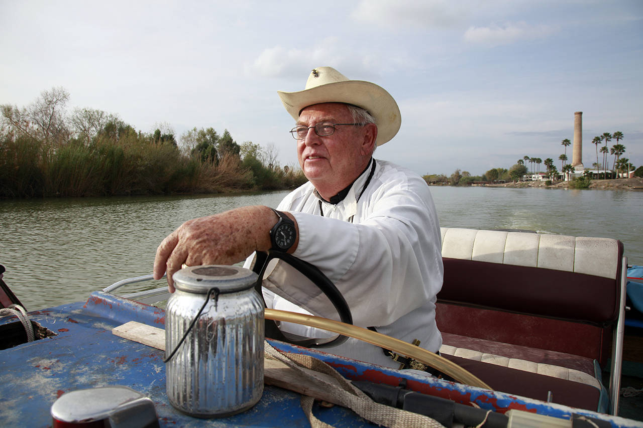 Father Roy Snipes, pastor of the La Lomita Chapel, shows Associated Press journalists the land on either side of the Rio Grande at the US-Mexico border in Mission, Texas, on Tuesday. (AP Photo/John L. Mone)