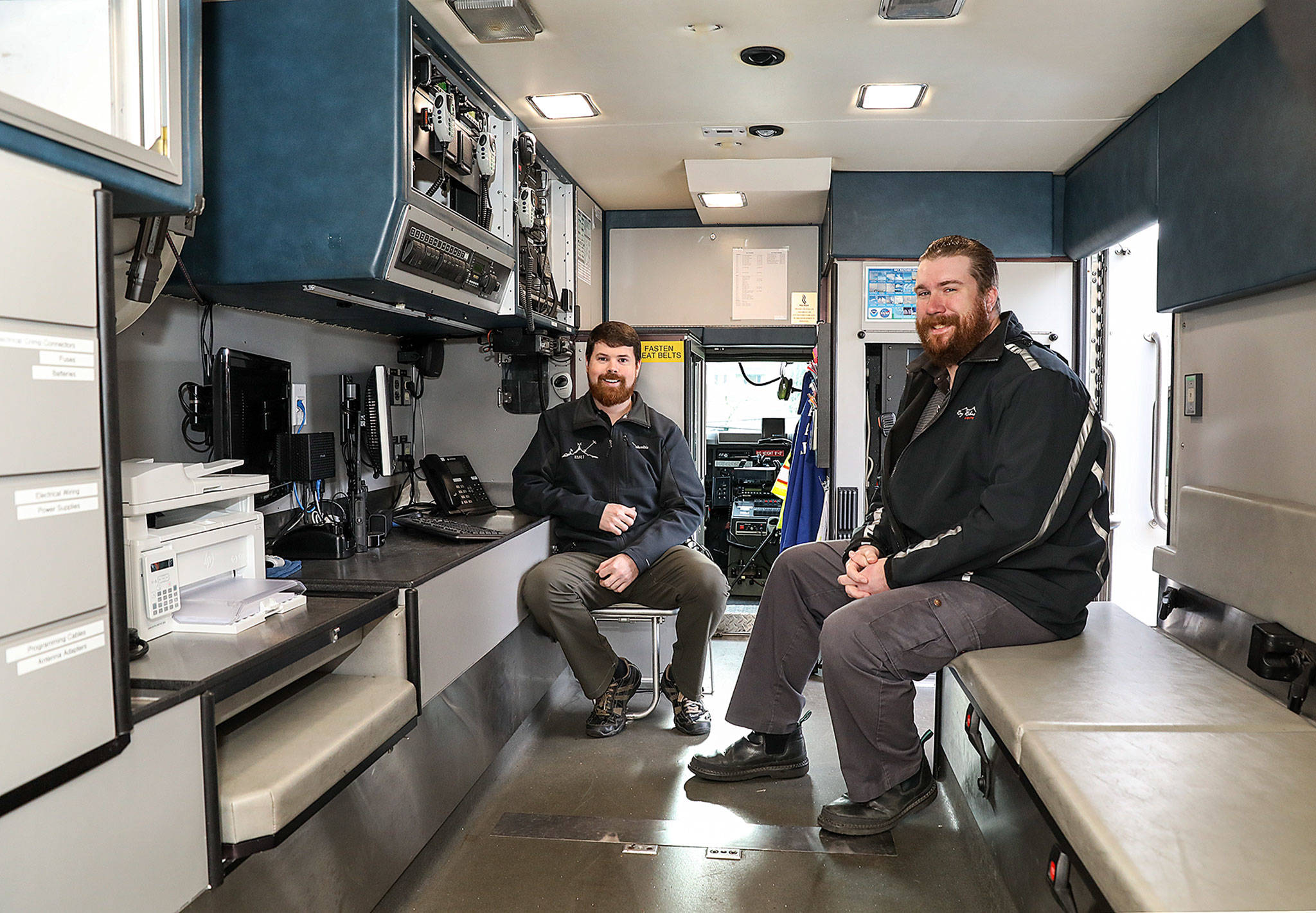 Longtime friends Kyle Burgess (left) and Matt Benjamin are helping the city of Marysville develop a communication system for emergency response. (Lizz Giordano / The Herald)
