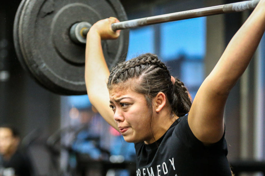 Keanna Krueger, 15, works out at Remedy Athletics in Marysville on Jan. 9, ahead of her trip to Miami for Wodapalooza, an international CrossFit competition. (Kevin Clark / The Herald)
