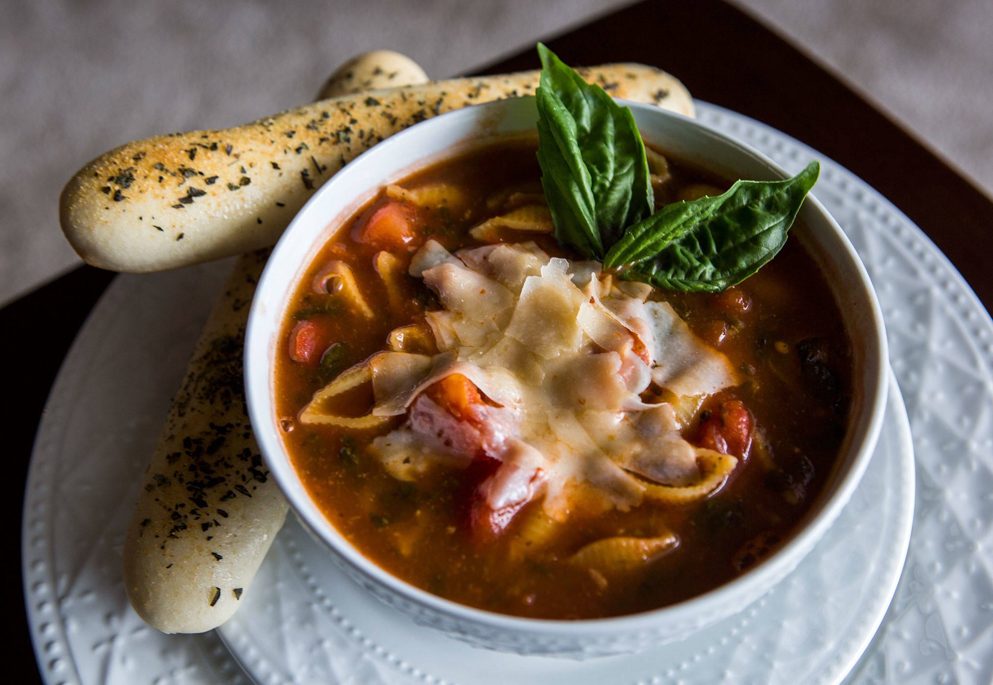 Pasta Fagioli with fresh breadsticks, basil and shredded parmesan cheese. (Olivia Vanni / The Herald)