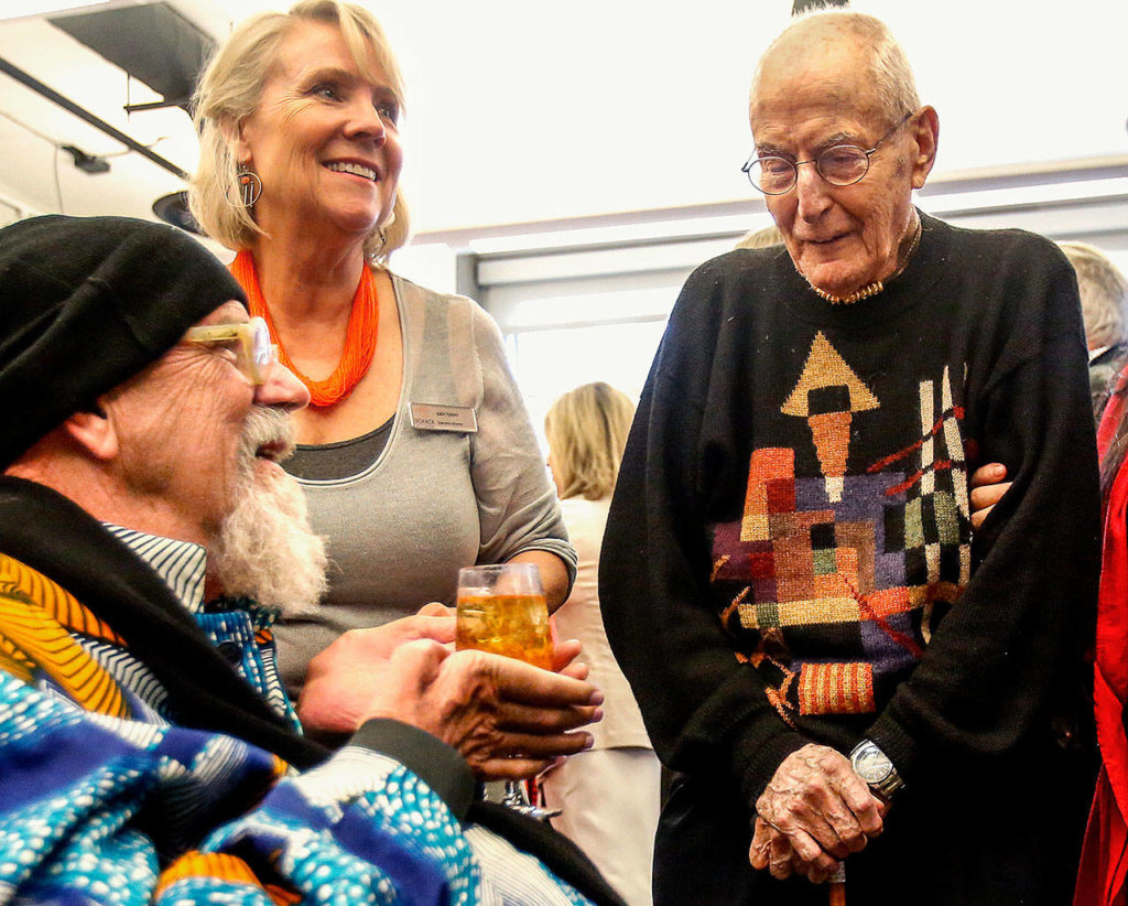 At his reception May 26, 2016 at Schack Art Center in Everett, renowned artist Chuck Close (left) shares a laugh with his former art instructor Russell Day while visiting with him and Judy Tuohy, the Schack’s executive director. Day died Monday at age 106. (Dan Bates / The Herald)
