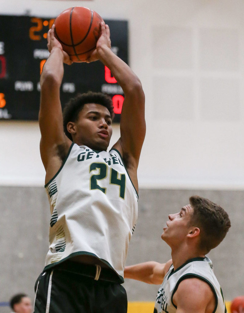 Marysville Getchell sophomore Malakhi Knight controls the ball as Dylan Rice watches during practice on Jan. 16, 2019, at Marysville Getchell High School. (Kevin Clark / The Herald)
