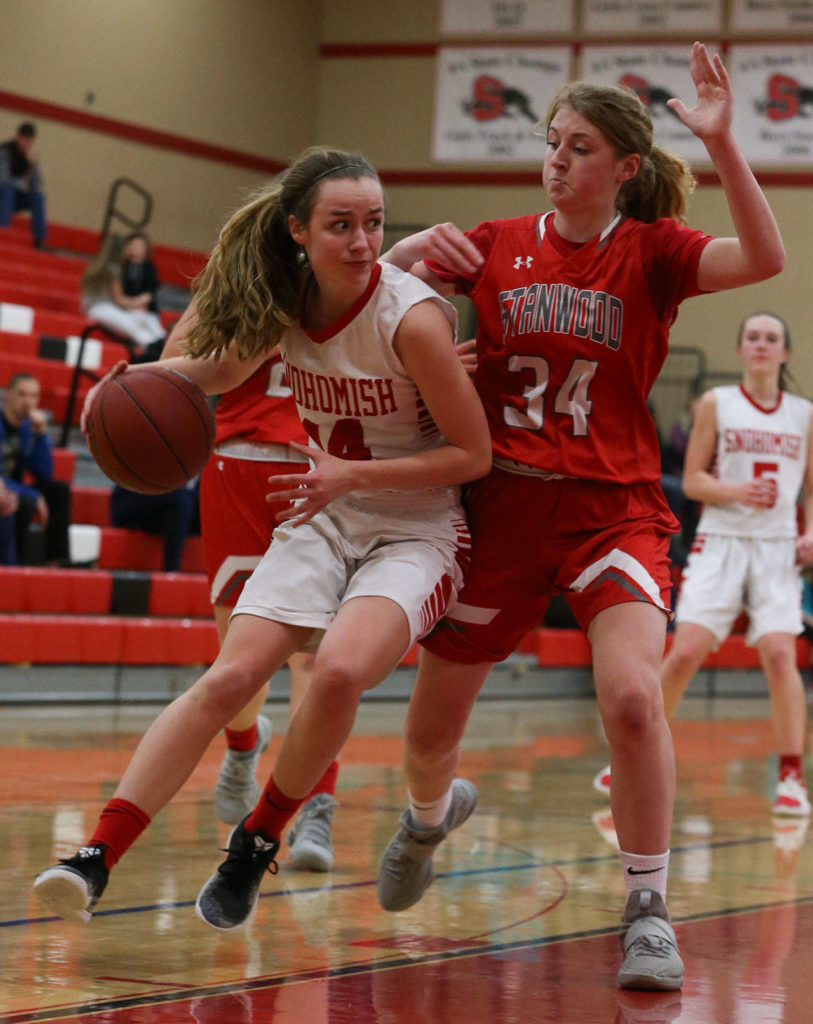 Smohomish’s Maya DuChesne (left) drives against Stanwood’s Taylor Murphy during a Wesco 3A girls basketball game Thursday in Snohomish. DuChesne scored a game-high 16 points in the Panthers’ 55-38 win. (Kevin Clark / The Herald)
