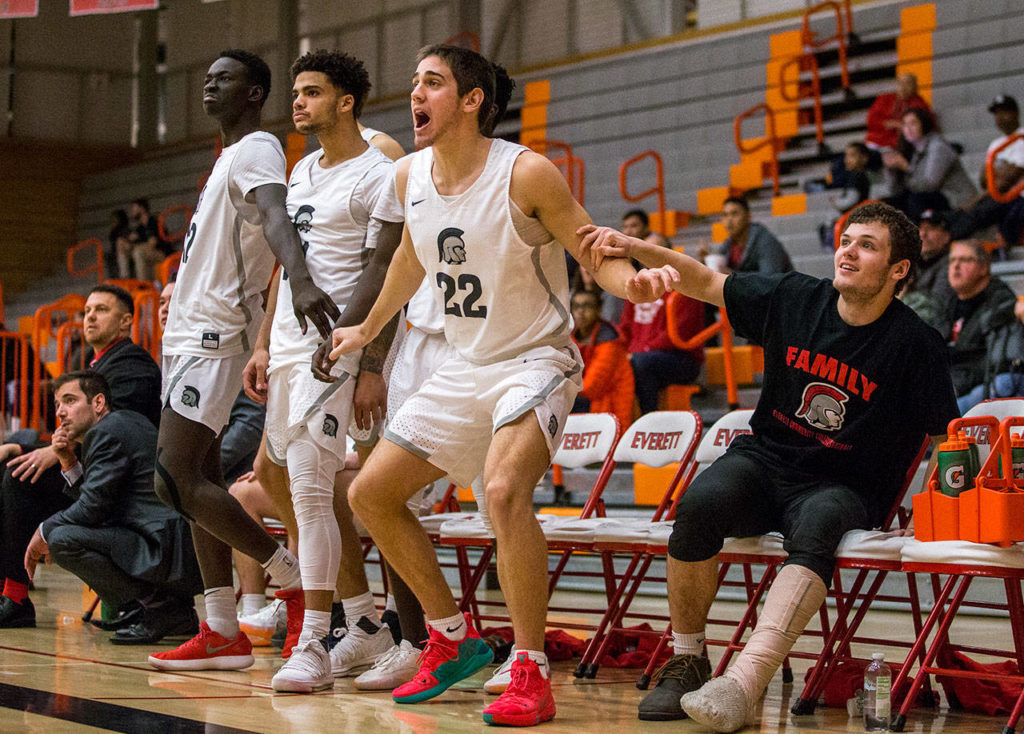 The Everett bench reacts to a teammate making a 3-pointer during a game against Edmonds on Jan. 19, 2019, in Everett. (Olivia Vanni / The Herald)
