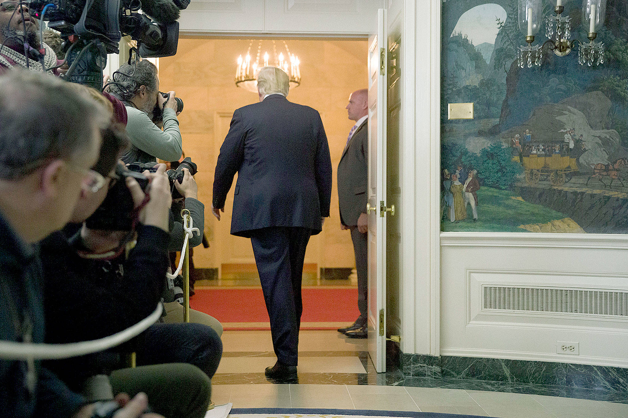 President Donald Trump departs after speaking about the partial government shutdown, immigration and border security in the Diplomatic Reception Room of the White House in Washington on Saturday. (AP Photo/Alex Brandon)