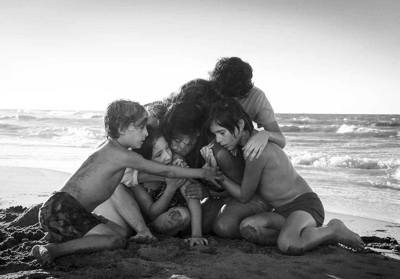 This image shows Yalitza Aparicio (center) in a scene from the film “Roma,” by filmmaker Alfonso Cuaron. (Carlos Somonte/Netflix via AP)