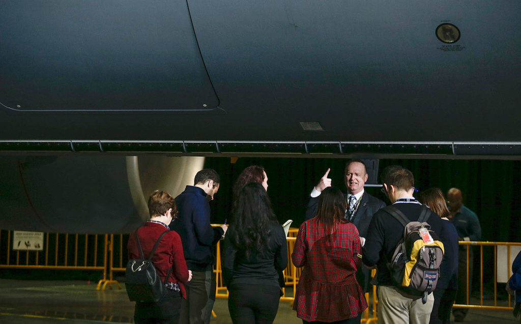 Mike Hafer, Boeing’s senior manager for KC-46 business development., explains features of the KC-46 Pegasus tanker to reporters before the start of a delivery ceremony in the Boeing factory at Paine Field in Everett on Thursday. (Andy Bronson / The Herald)

