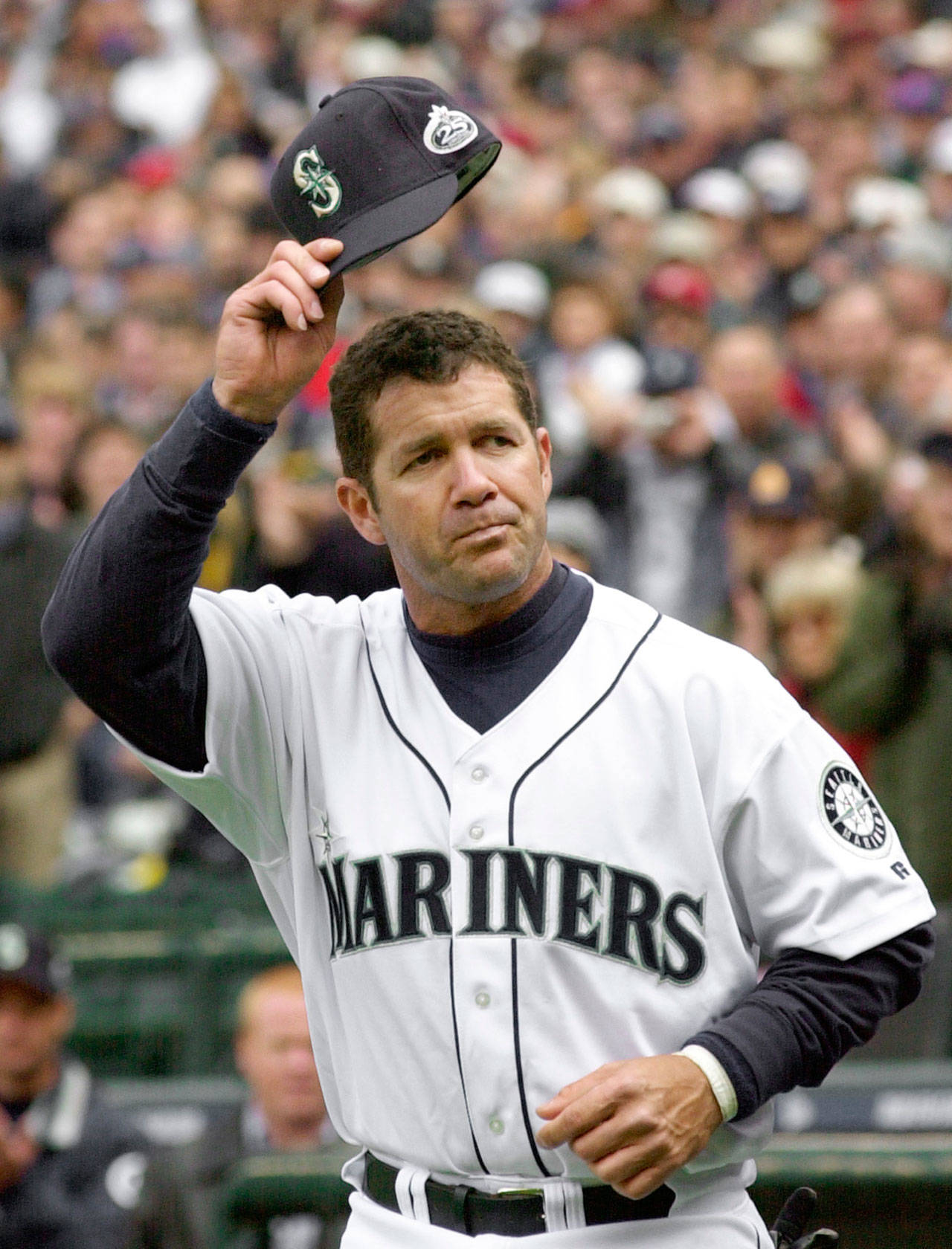 Edgar Martinez tips his cap to the crowd as he is introduced on Opening Day in 2002. Martinez spent his entire 18-year major-league career with the Mariners. (AP Photo/Elaine Thompson)