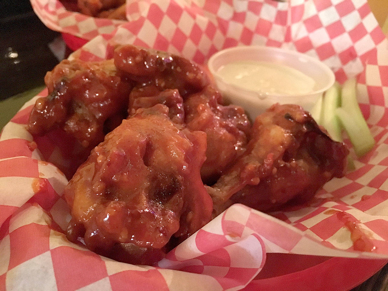 Chicken wings with a Korean BBQ sauce over them are a tasty mix of sweet with a small bite of spice to them at That Chicken Place in Everett. (Ben Watanabe / The Herald)