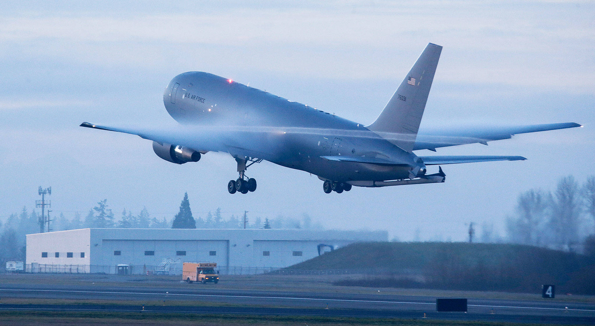 Condensation flows over the wings of the second of two Boeing KC-46 Pegasus tankers to take off from Paine Field on Friday in Everett. (Andy Bronson / The Herald)