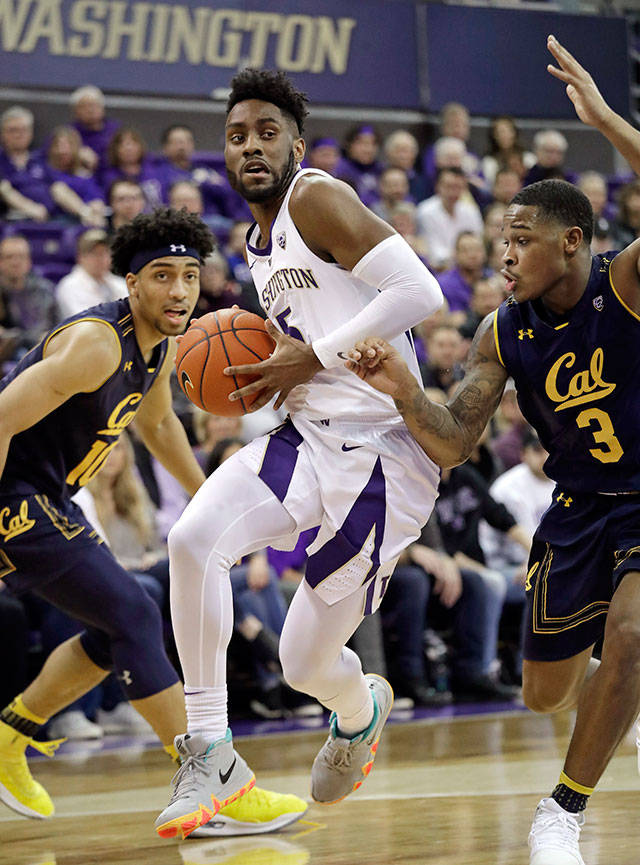 Washington’s Jaylen Nowell (center) drives between California’s Justice Sueing (left) and Paris Austin during the first half of a game on Jan. 19, 2019, in Seattle. (AP Photo/Elaine Thompson)