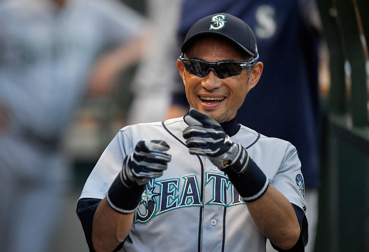 The Mariners’ Ichiro Suzuki jokes around with teammates in the dugout prior to a game against the Angels on July 27, 2018, in Anaheim, Calif. (AP Photo/Mark J. Terrill)