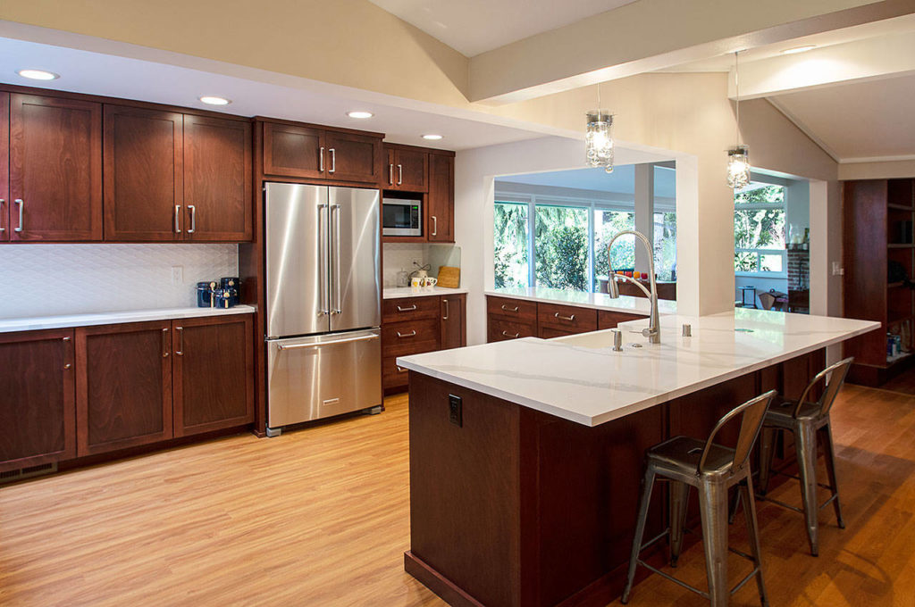 These before-and-after photos of this Edmonds home show the just how much a remodeling project can change the look and feel of a kitchen. (Chermak Construction, Inc.)
