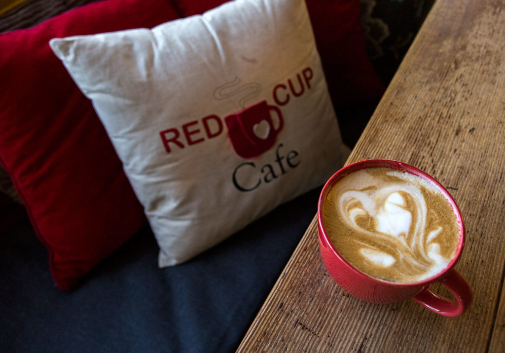 A latte with heart art at Red Cup Cafe in Mukilteo. (Olivia Vanni / The Herald)
