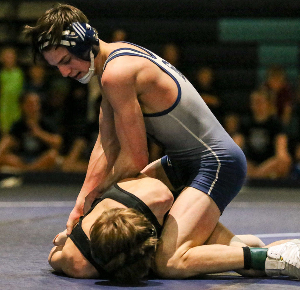 Sultan’s Luke Weaver (right) works to pin Granite Falls’ Howard Wilde during a meet on Jan. 24, 2019, at Sultan High School. (Kevin Clark / The Herald)
