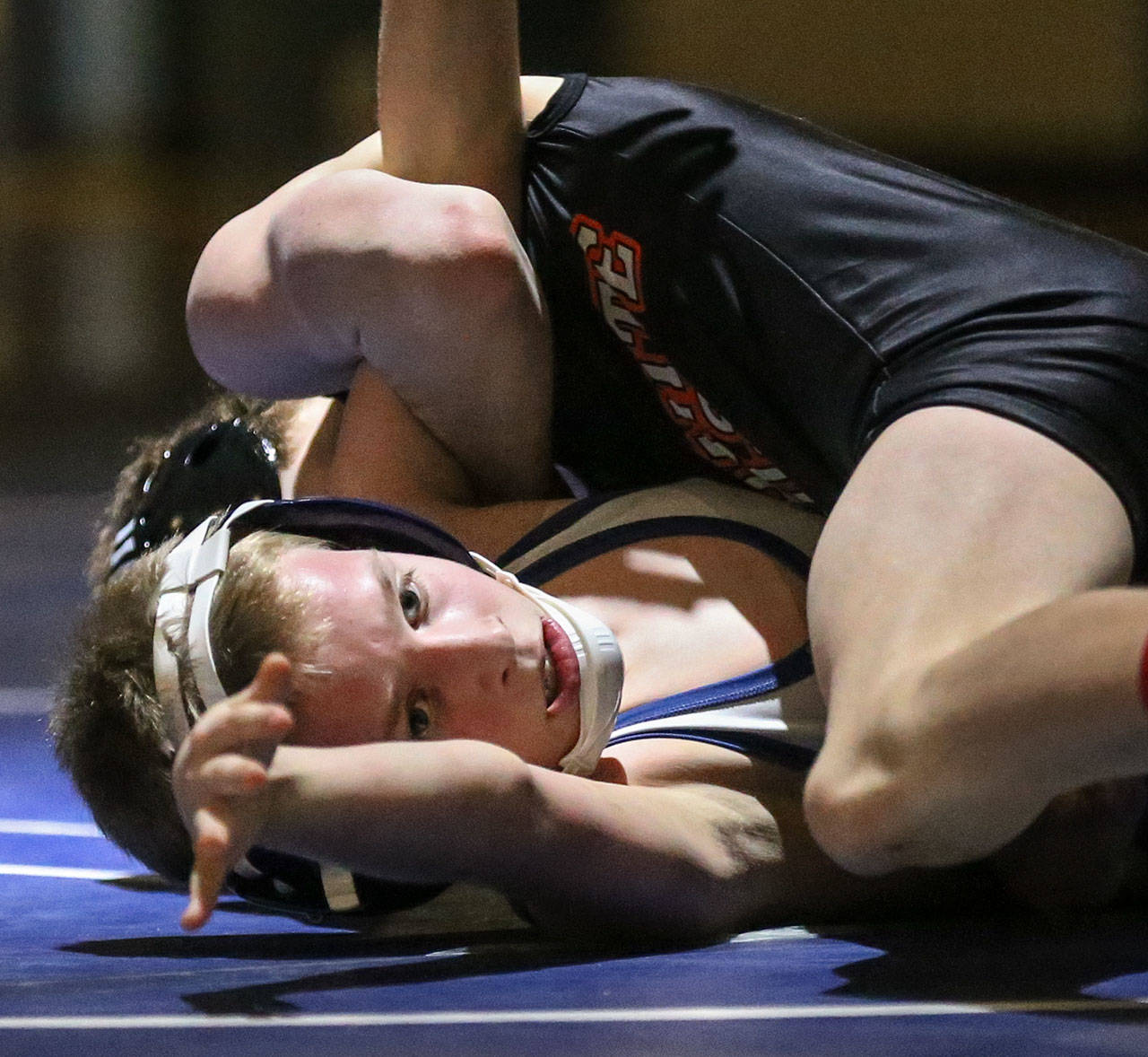 Granite Falls’ Riley Hoople works to pin Sultan’s Daniel Krause during a meet on Jan. 24, 2019, at Sultan High School. (Kevin Clark / The Herald)