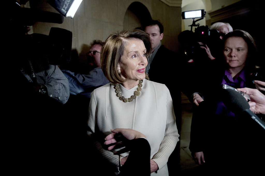 House Speaker Nancy Pelosi speaks to members of the media as she arrives on Capitol Hill in Washington on Friday. (AP Photo/Andrew Harnik)
